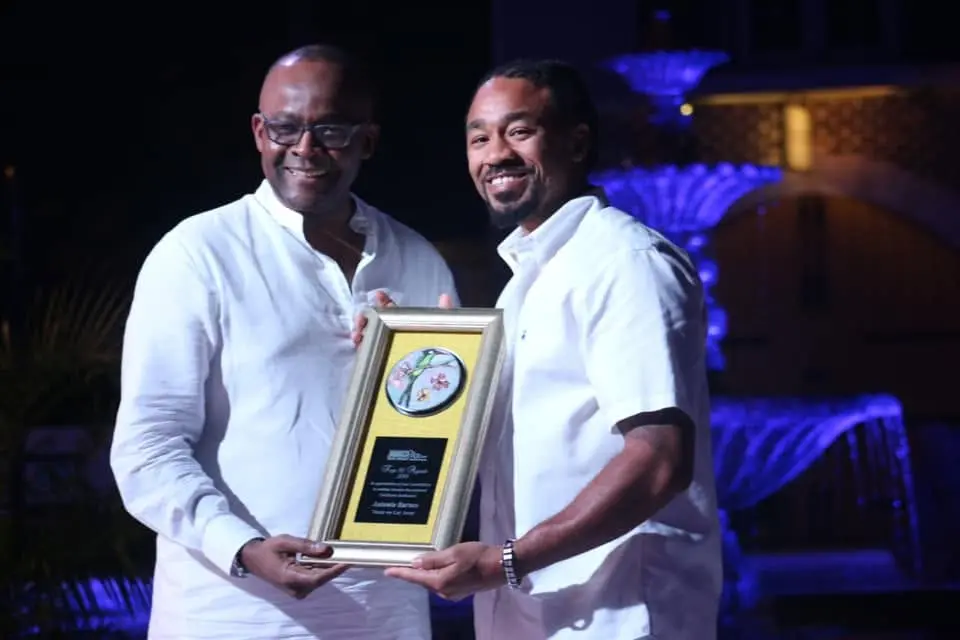 Antonio Tone Barnes receiving Jamaica travel-specialist recognition