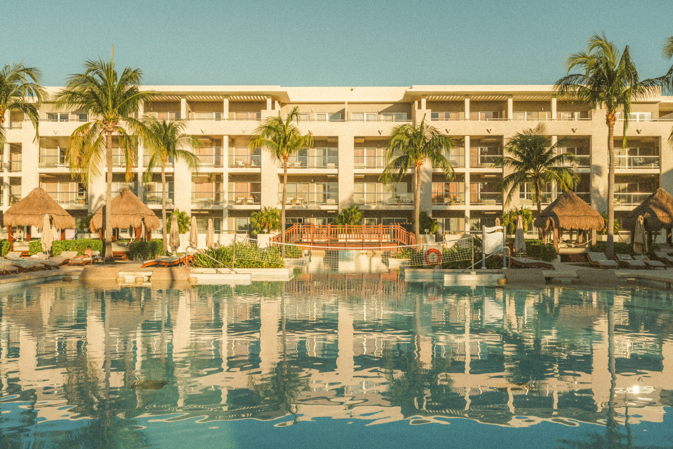 Pool and palms at Paradisus La Perla resort